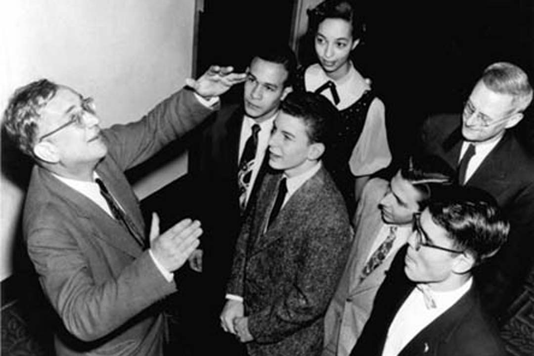 George Gamow pointing and explaining an idea to students
